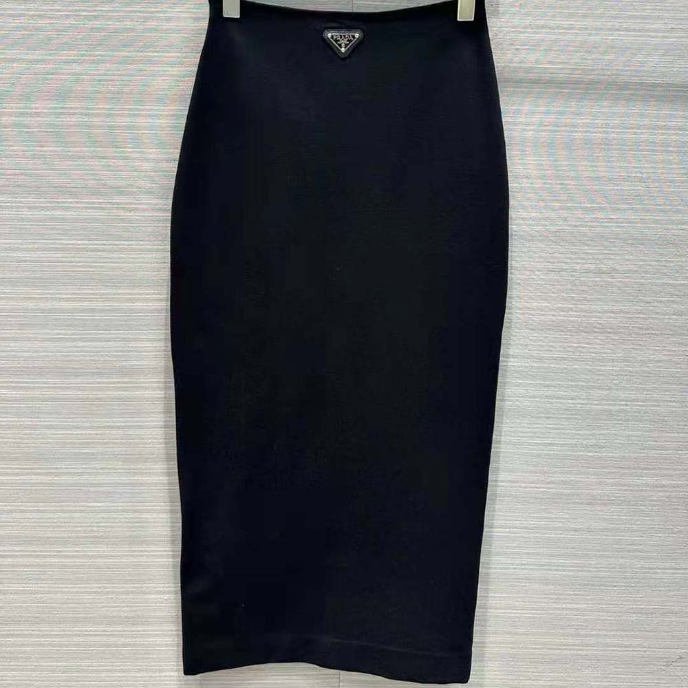 Side angle showing slim silhouette of Prada Women Stretch Natté Midi-Skirt