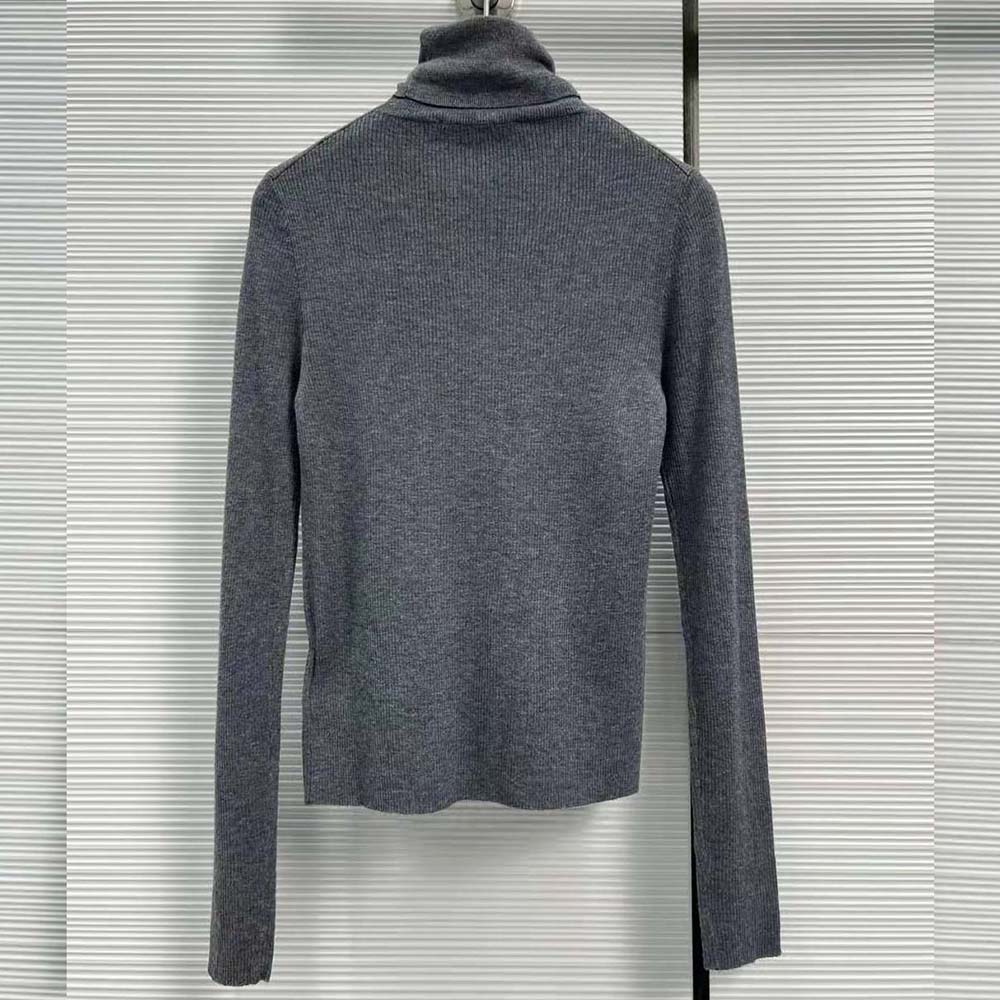 Side angle showing fitted silhouette of Prada Black Wool Turtleneck Sweater