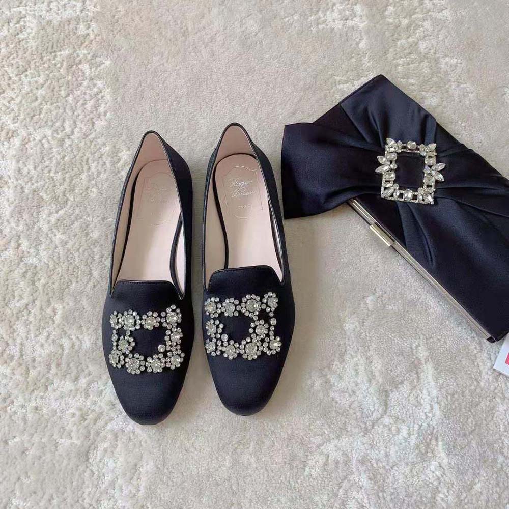 Close-up of flower strass embroidered buckle on Roger Vivier satin loafers