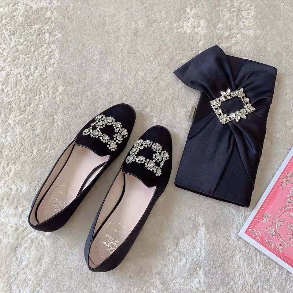 Top view showing black satin and signature buckle on Roger Vivier loafers