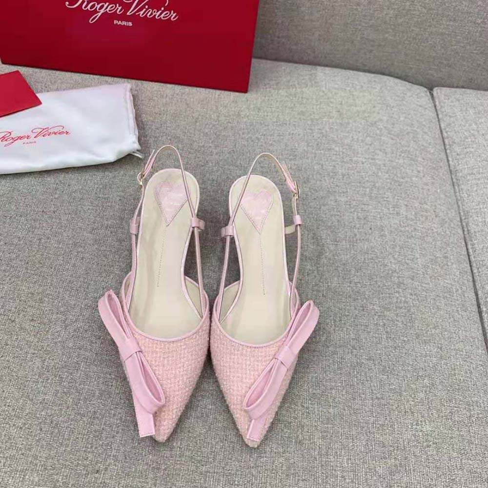 Close-up of pink fabric texture and Virgule bow detail on slingback pumps