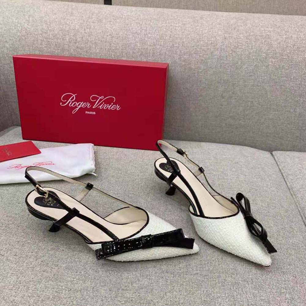 Rear angle showing adjustable slingback strap on Roger Vivier white pumps