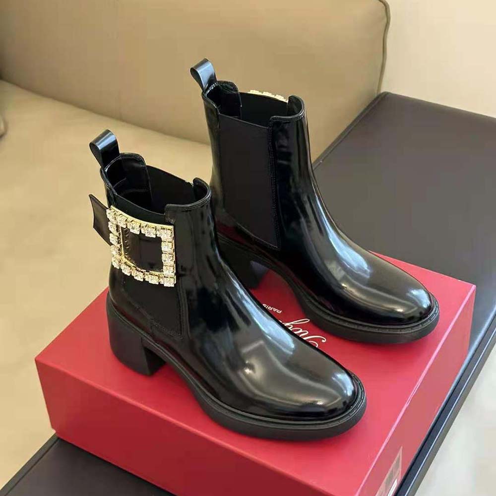 Front angle showing glossy black patent leather on Roger Vivier Chelsea boots