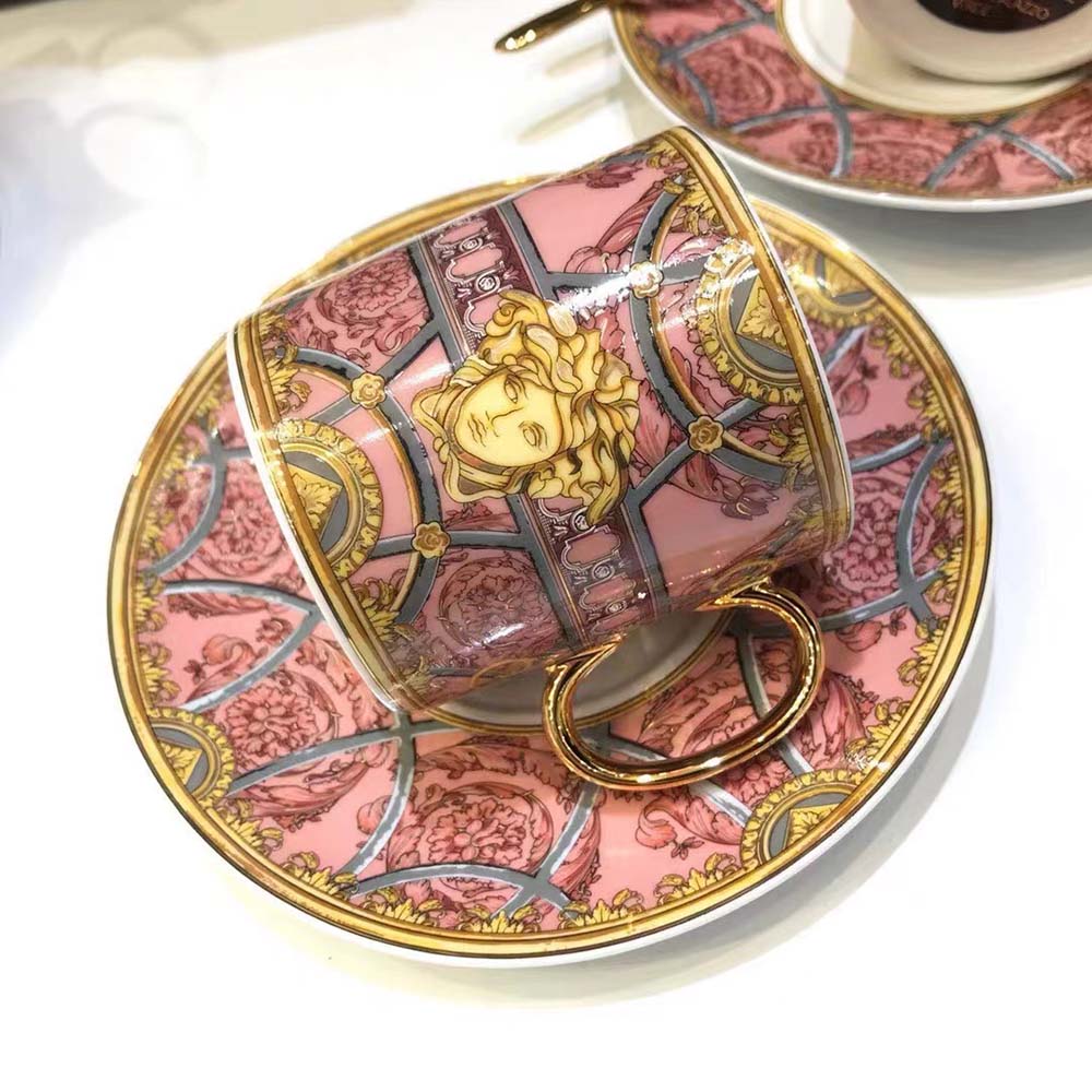 Top-down view of pink ceramic surface on Versace Unisex Scala Del Palazzo Verde Mug-Pink
