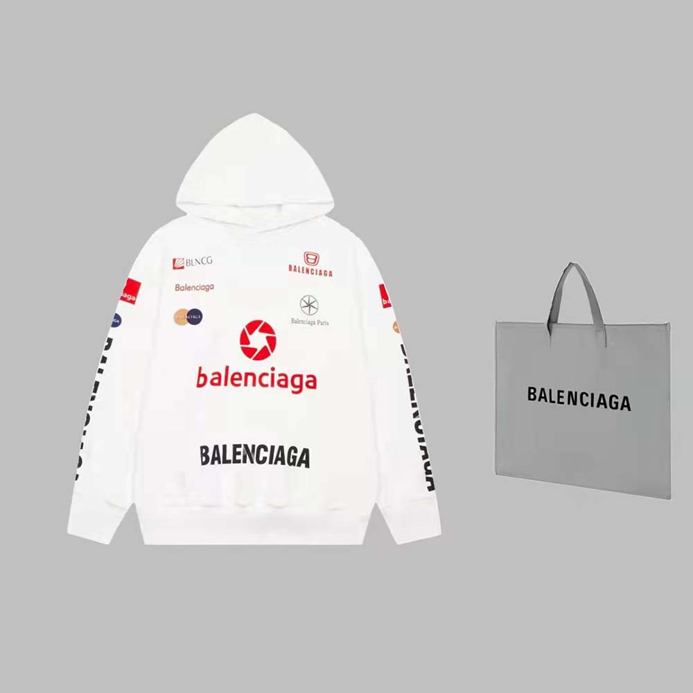 Close-up detail of signature Balenciaga logo on oversized white hoodie