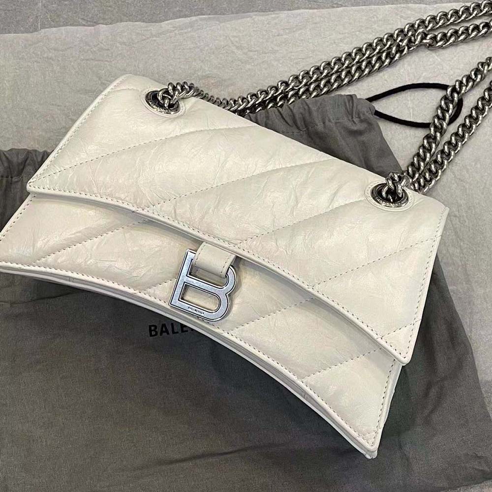 Close-up of quilted leather and silver chain of Balenciaga Women Crush bag