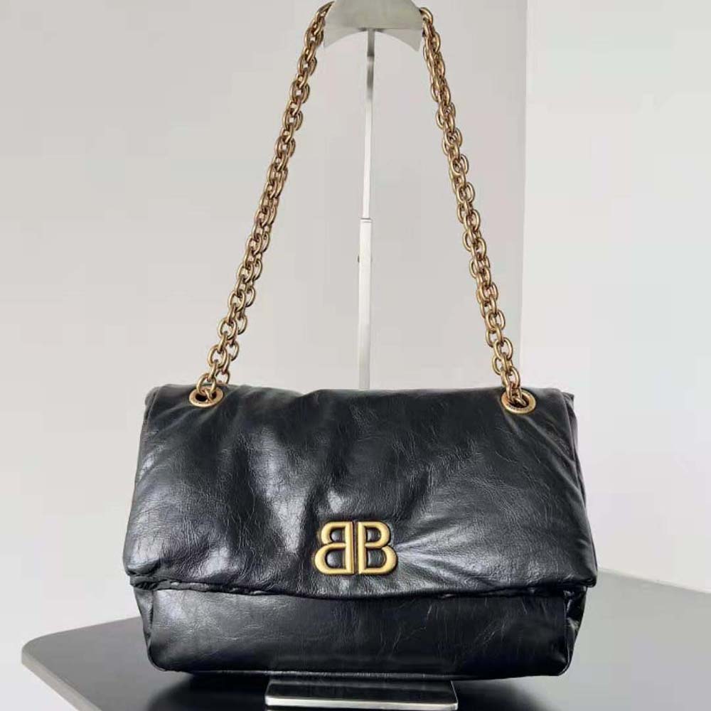 Close-up of oversized silver chain hardware on Balenciaga Women Monaco Bag