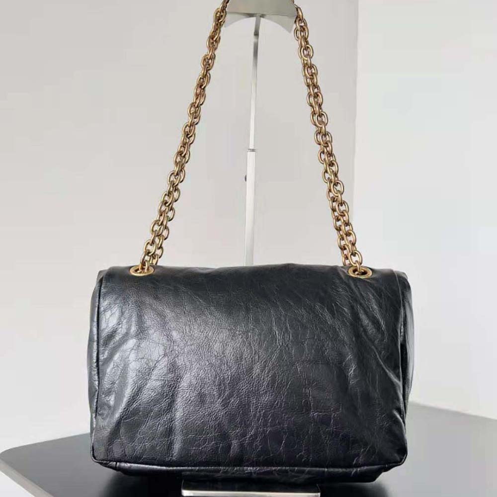 Side profile showing smooth black arena calfskin and flap closure detail