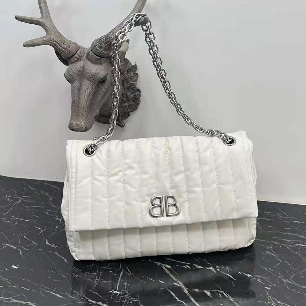 Side angle showing flap closure of Balenciaga Women Monaco Medium Chain Bag