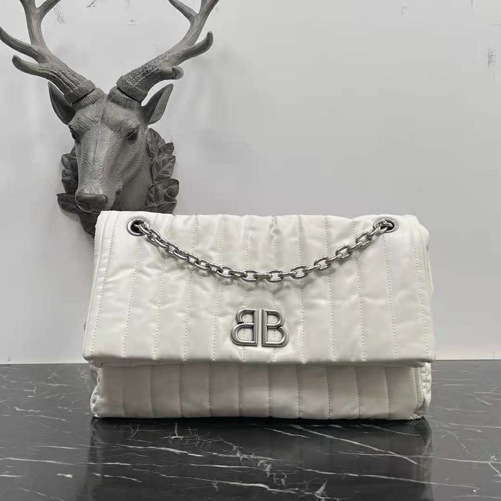 Close-up of quilted leather and silver chain on Balenciaga Women Monaco Bag