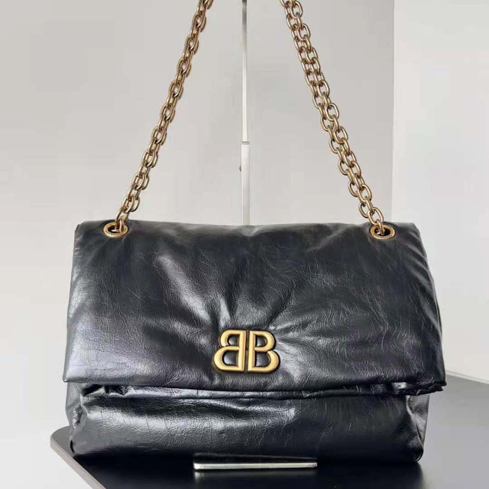 Close-up detail of silver chain strap on Balenciaga Monaco Medium Chain Bag