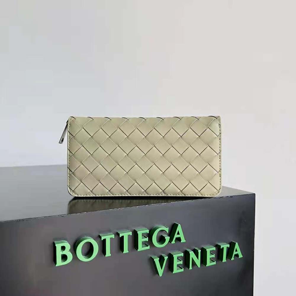 Close-up of yellow intrecciato leather detail on Bottega Veneta wallet