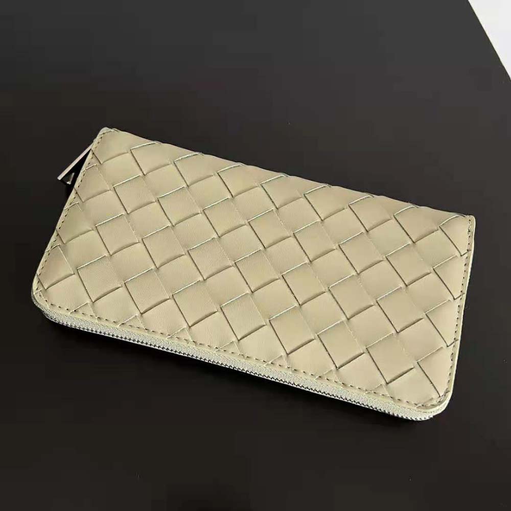 Side profile showing zip closure and gold-tone hardware on wallet
