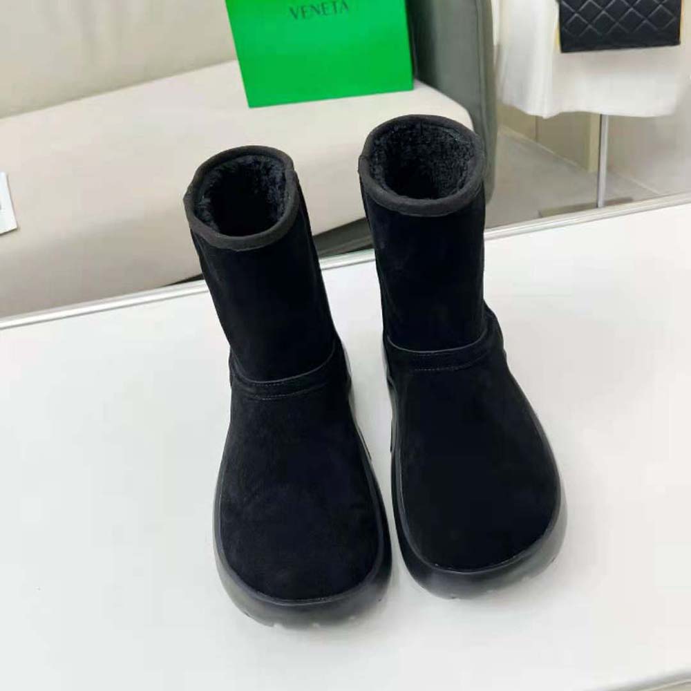 Close-up showing shearling texture and snap closure detail on the Bottega Veneta boot