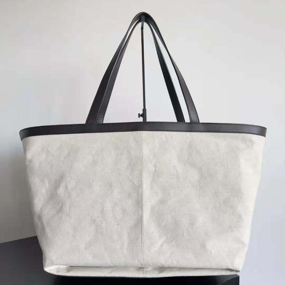 Side angle showing gold-tone hardware on Bottega Veneta Flip Flap handbag