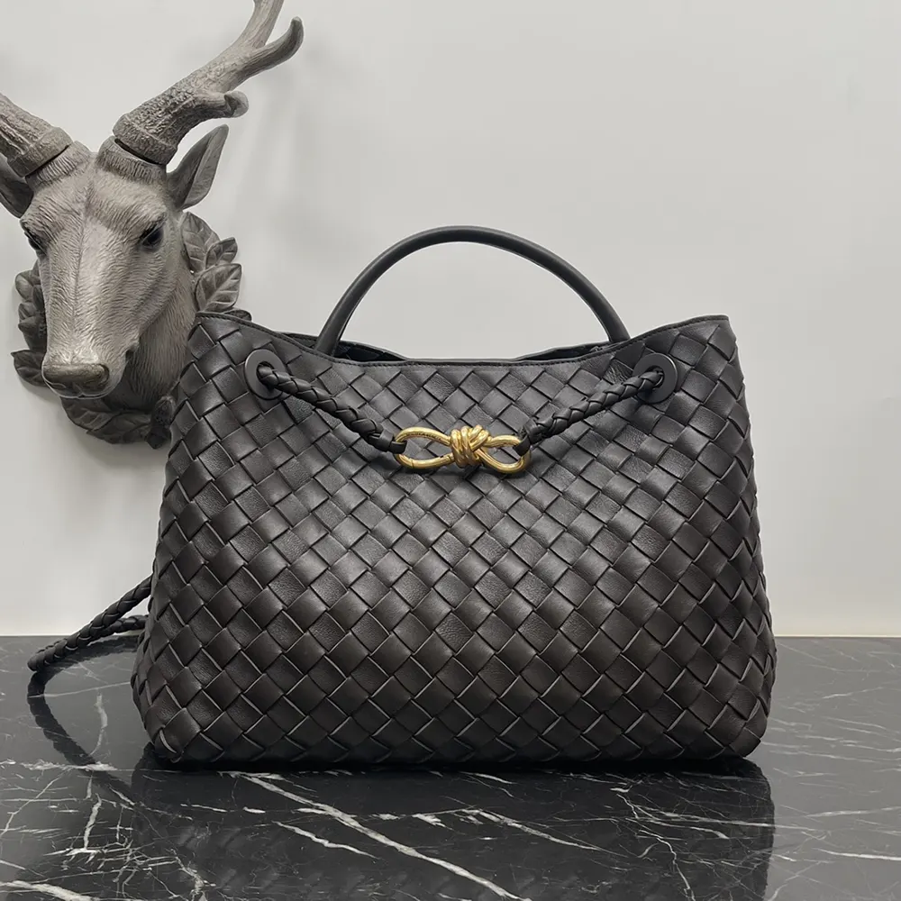 Close-up of chocolate brown lambskin and gold hardware on Bottega Veneta Andiamo bag