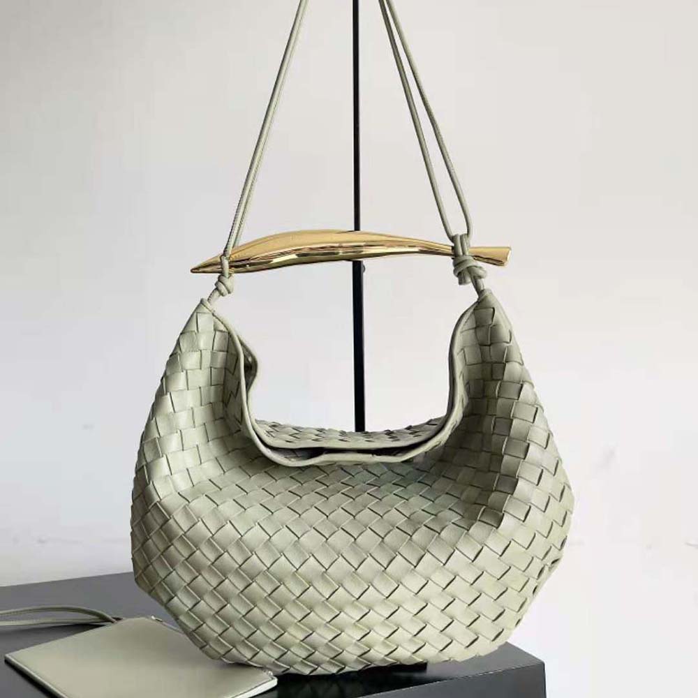 Side angle showing gold-tone hardware on green Bottega Veneta Medium Sardine