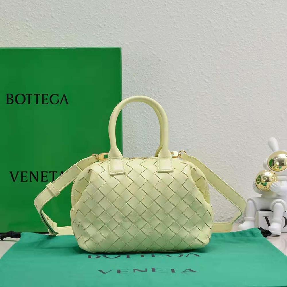Side angle showing gold hardware and zip of Bottega Veneta Women Mini Bauletto Yellow