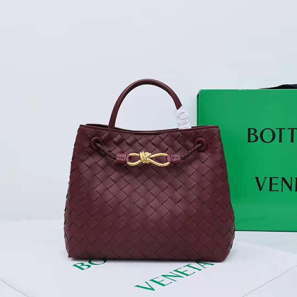 Close-up of gold-tone hardware and signature weave on Small Andiamo bag