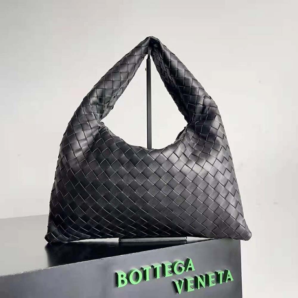 Close-up of black calfskin and woven craftsmanship on Small Hop bag