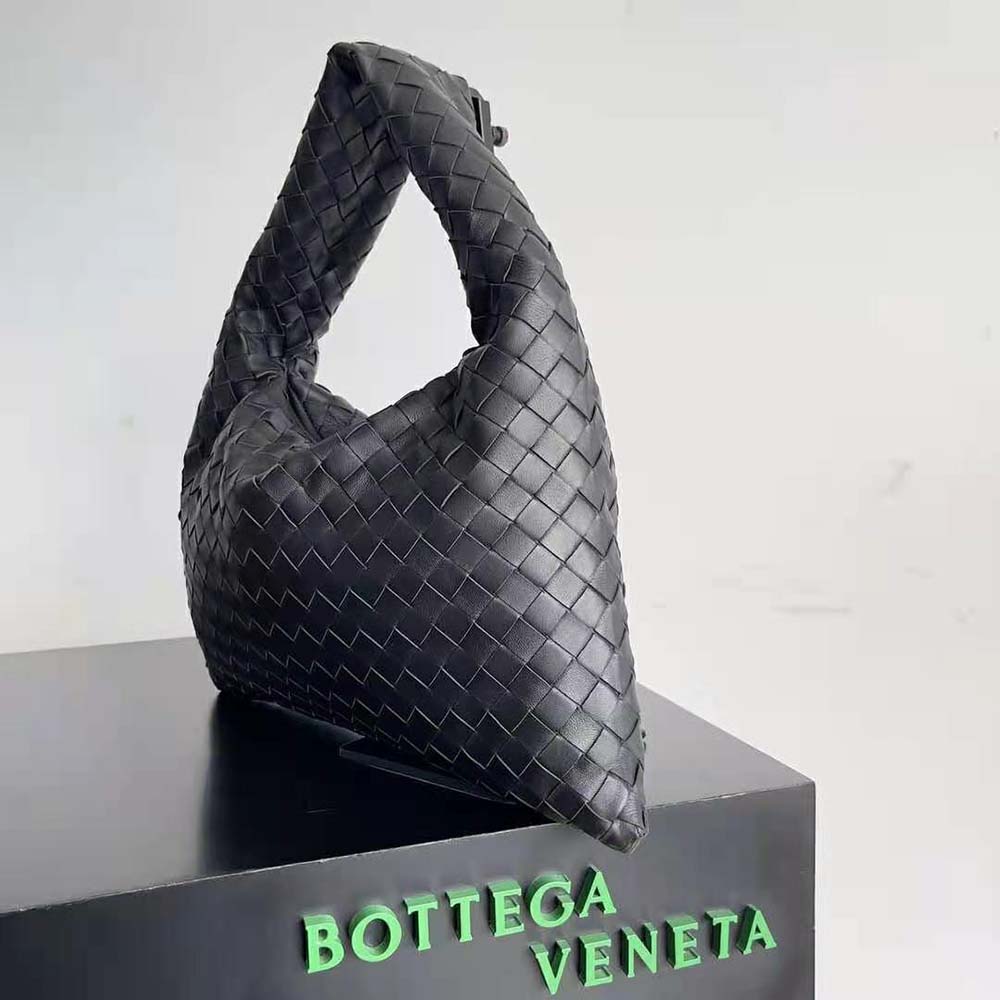 Side angle showing structured silhouette and hardware on Small Hop handbag