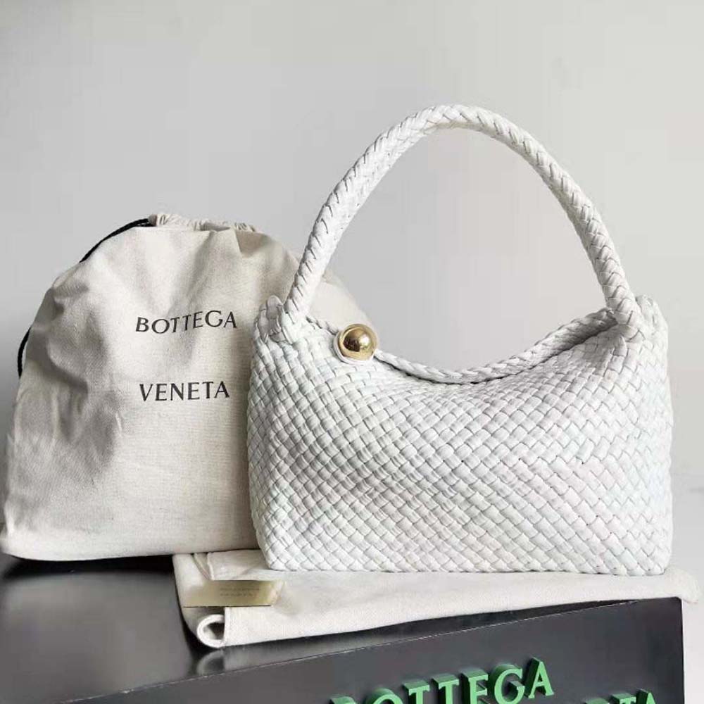 Close-up detail of woven white leather and silver sphere clasp on Tosca shoulder bag