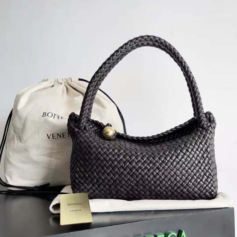 Close-up on the woven leather texture and sphere clasp of Tosca Shoulder Bag
