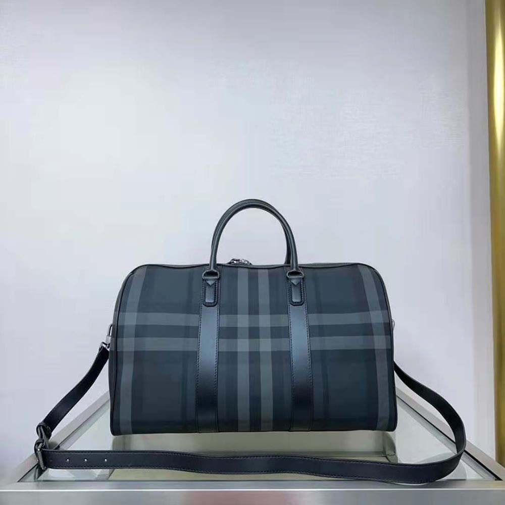 Side profile of Burberry Men Boston Holdall-Gray displaying leather trims