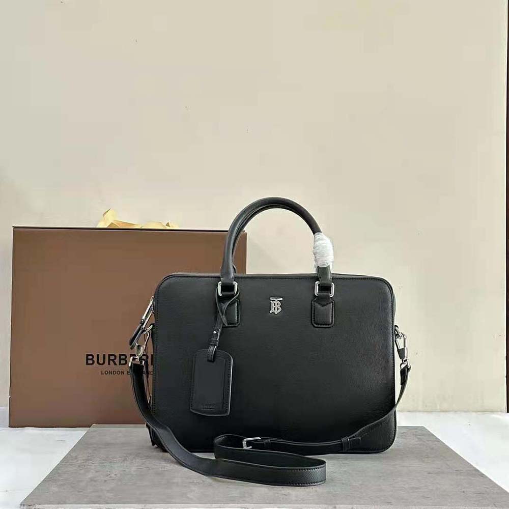 Close-up of Burberry Men Slim Ainsworth Briefcase-Black polished leather texture