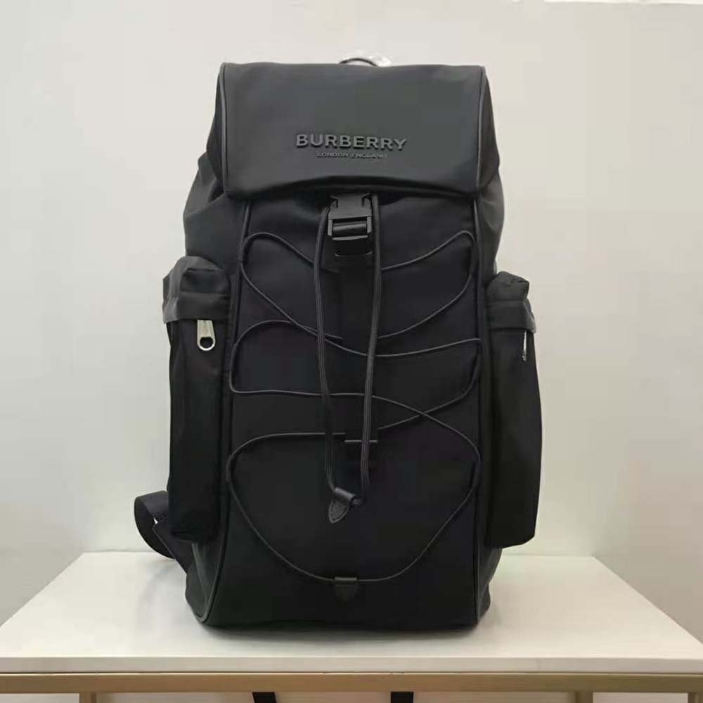 Close-up of leather trim and polished hardware on Burberry Unisex Murray Backpack-Black