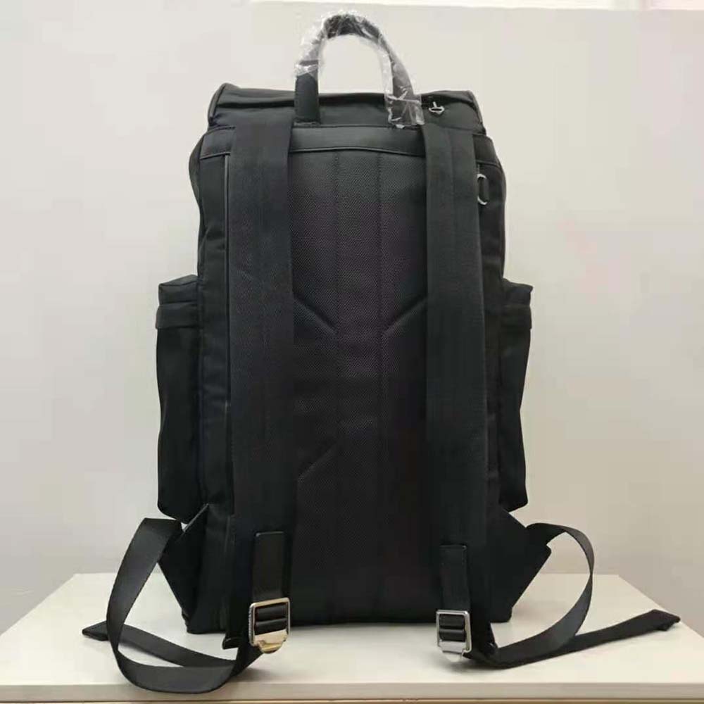 Side profile showing adjustable strap on Burberry Unisex Murray Backpack-Black