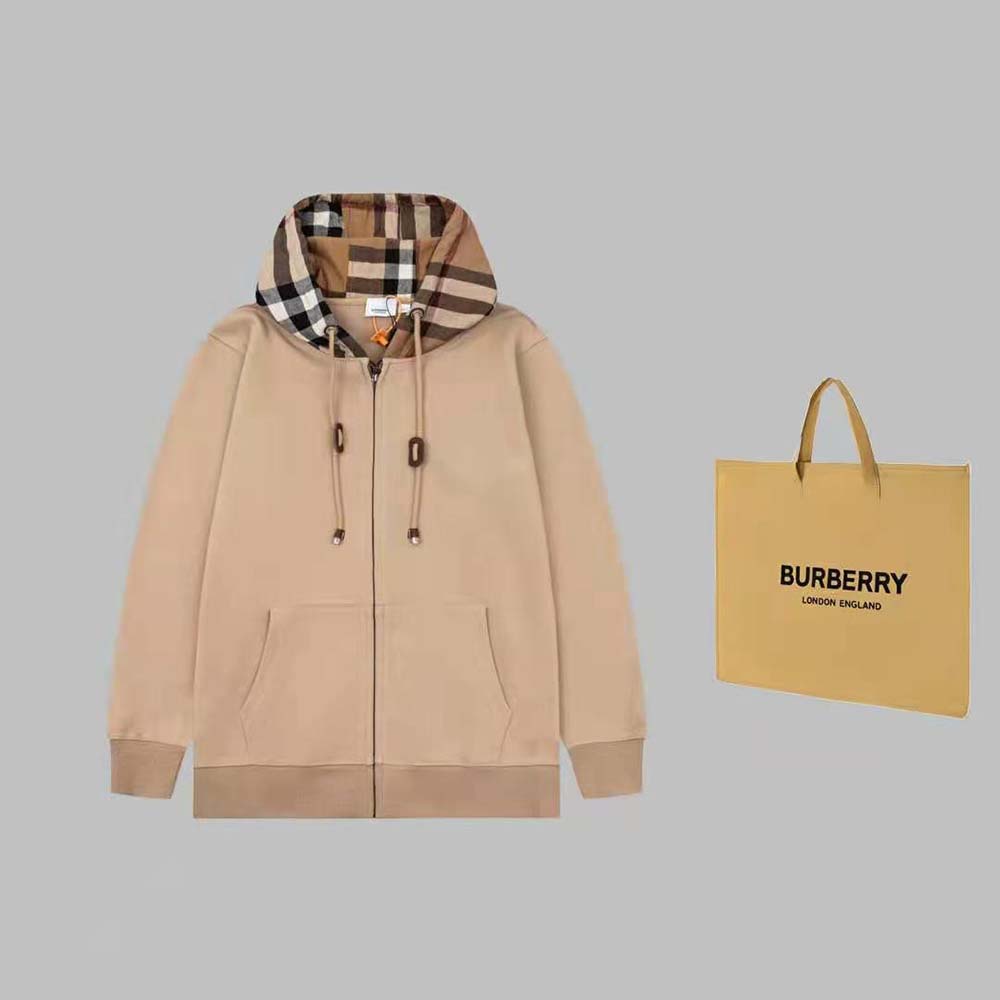 Close-up of Burberry check trim detailing on beige cotton hoodie hood