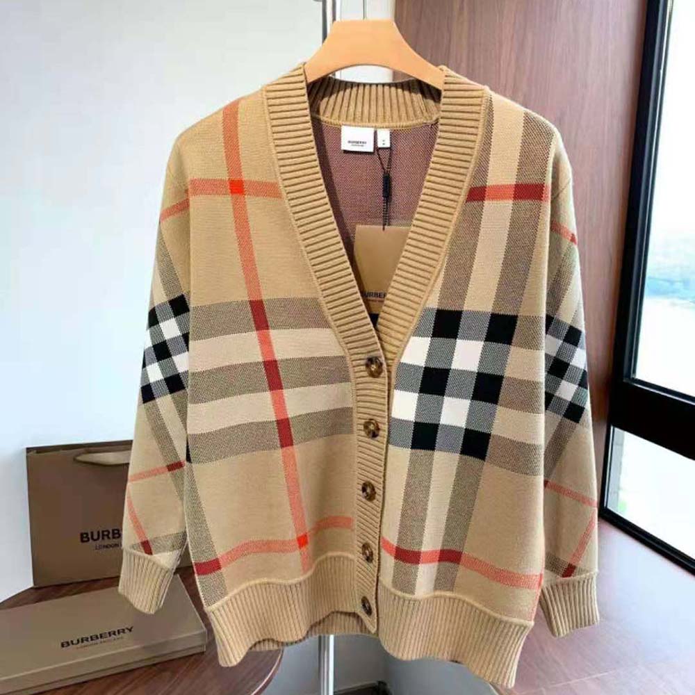 Close-up of button and check pattern on Burberry wool blend cardigan