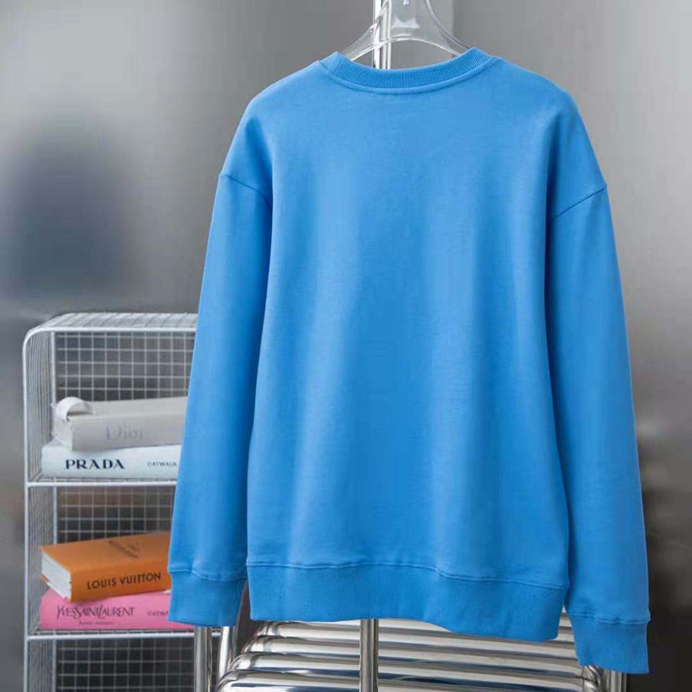 Side angle showing fit and texture of Burberry Men EKD Cotton Sweatshirt-Blue