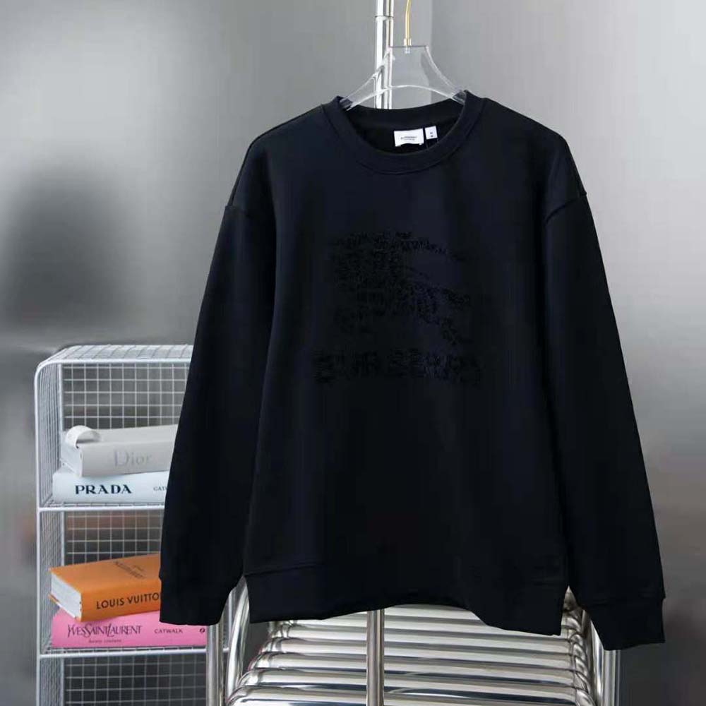 Close-up of black cotton fabric and EKD motif on Burberry sweatshirt