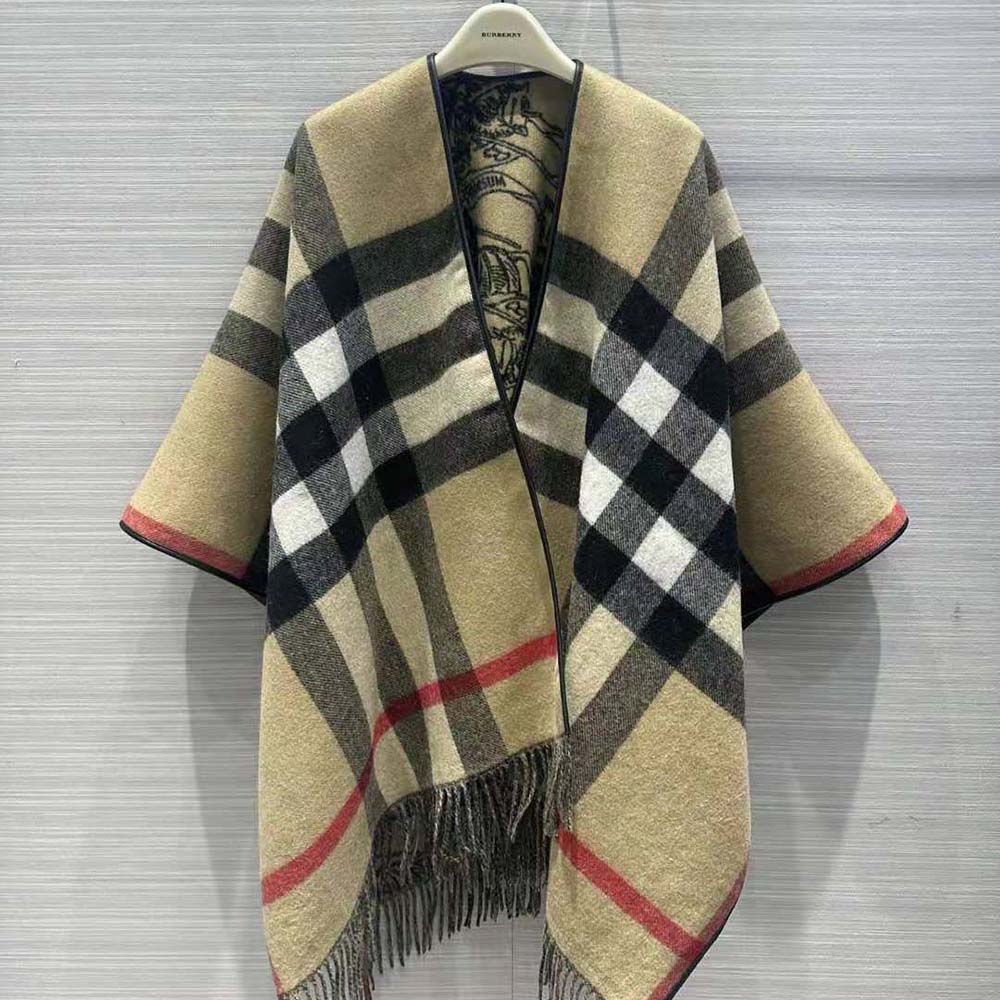 Close-up of Burberry signature hardware on brown wool cape