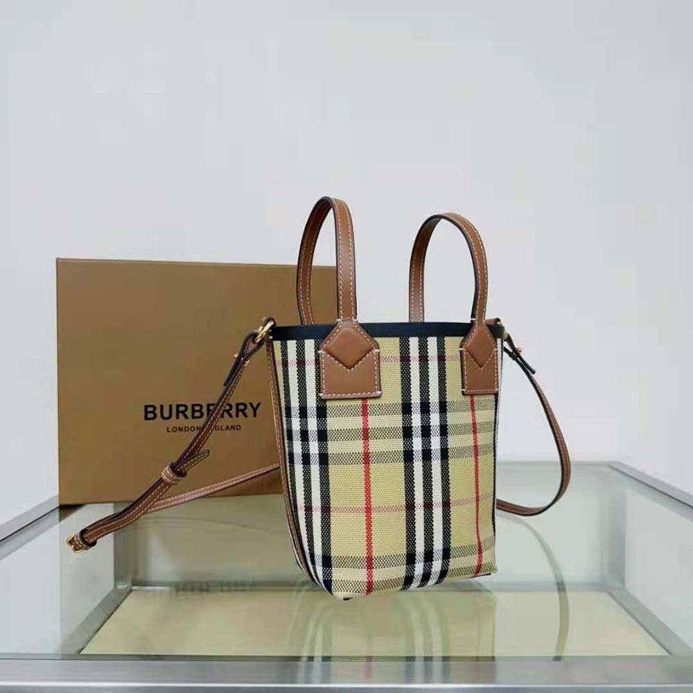 Side angle showing structured silhouette of Burberry Women Mini London Tote Bag-Brown