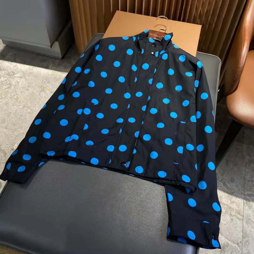 Close-up of blue nylon jacquard fabric and polka dots on Burberry jacket