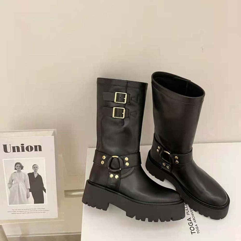 Top angle showing black calfskin texture on Celine bulky mid biker boots