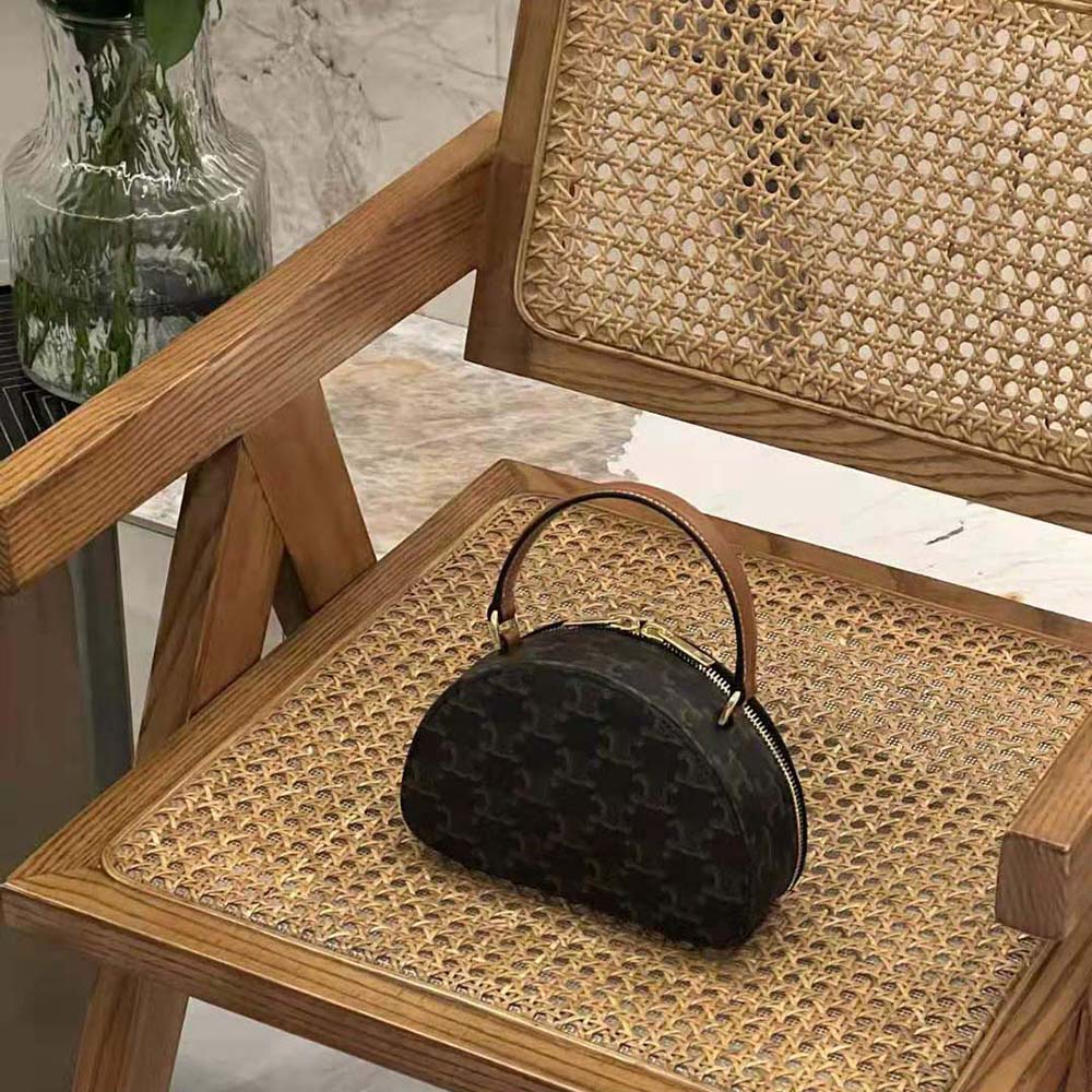 Side angle showing texture of Celine Women Half Moon Case Cuir Triomphe leather