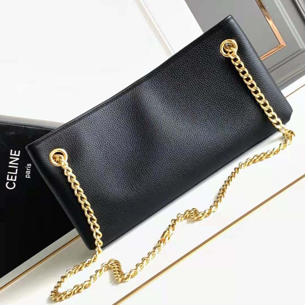 Side angle showing structured silhouette of Celine Women Medium Newspaper Bag