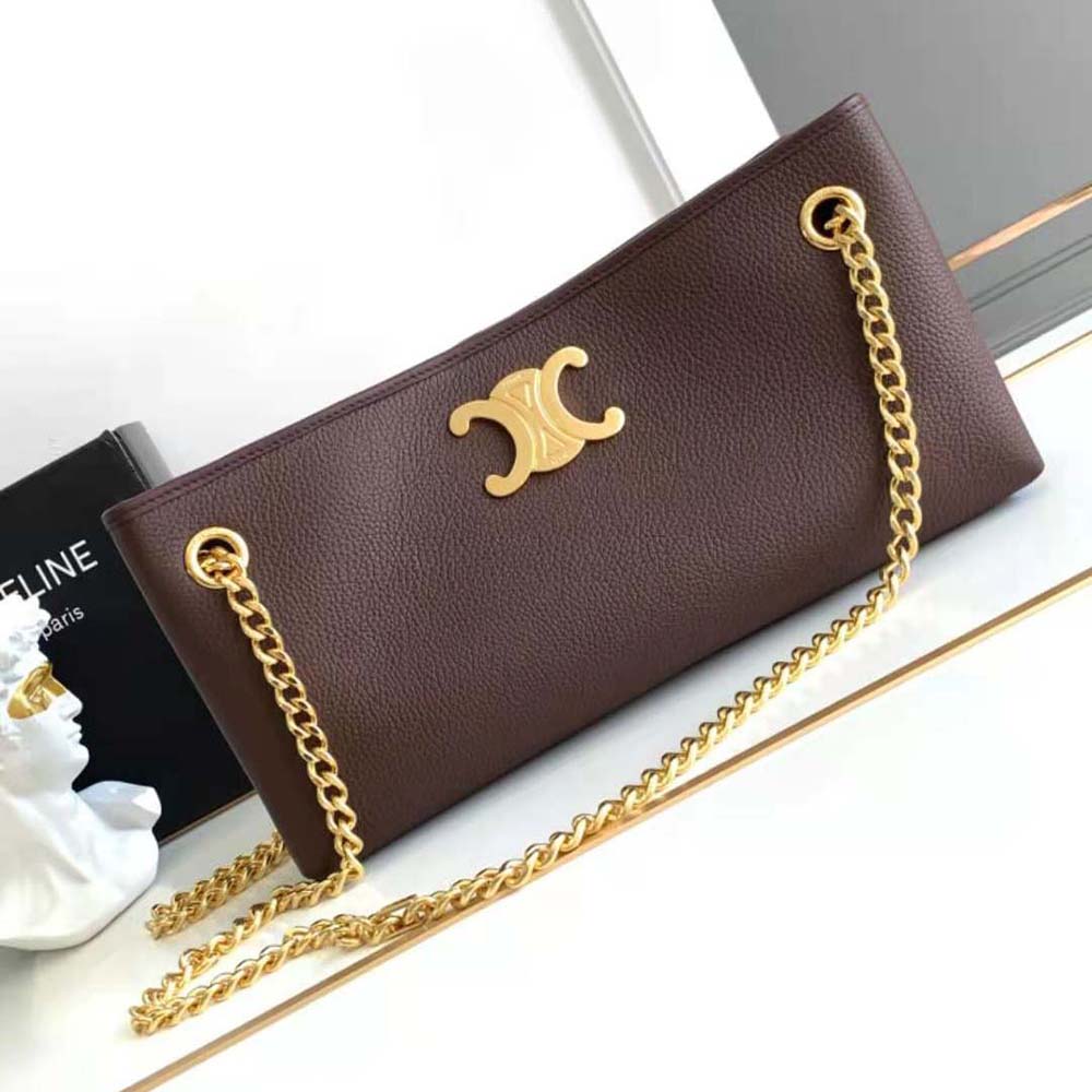Close-up of gold-tone hardware on Celine Women Medium Newspaper Bag maroon leather