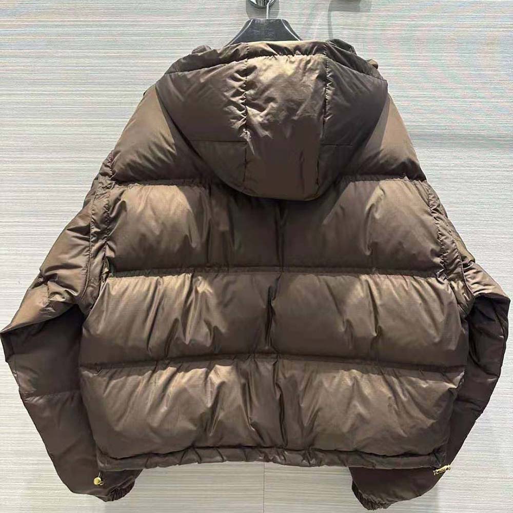 Side angle showing cropped silhouette of Celine Men Triomphe Cropped Down Jacket