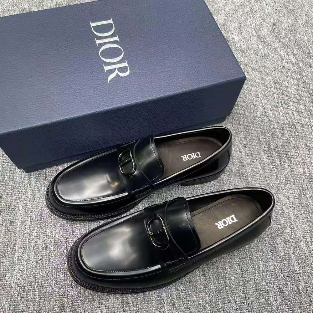 Close-up on silver Dior hardware on Granville Loafer black leather