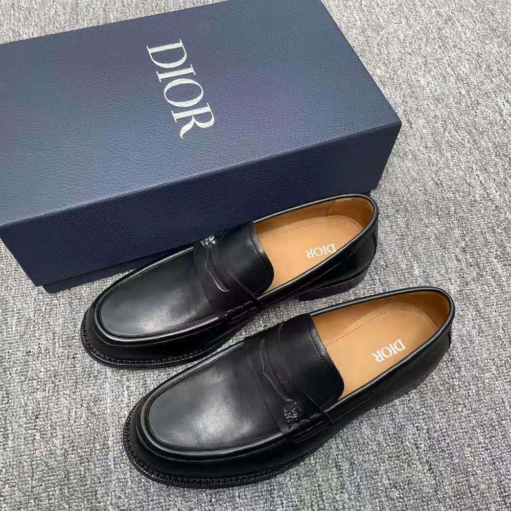 Close-up of smooth black calfskin and Dior hardware detail