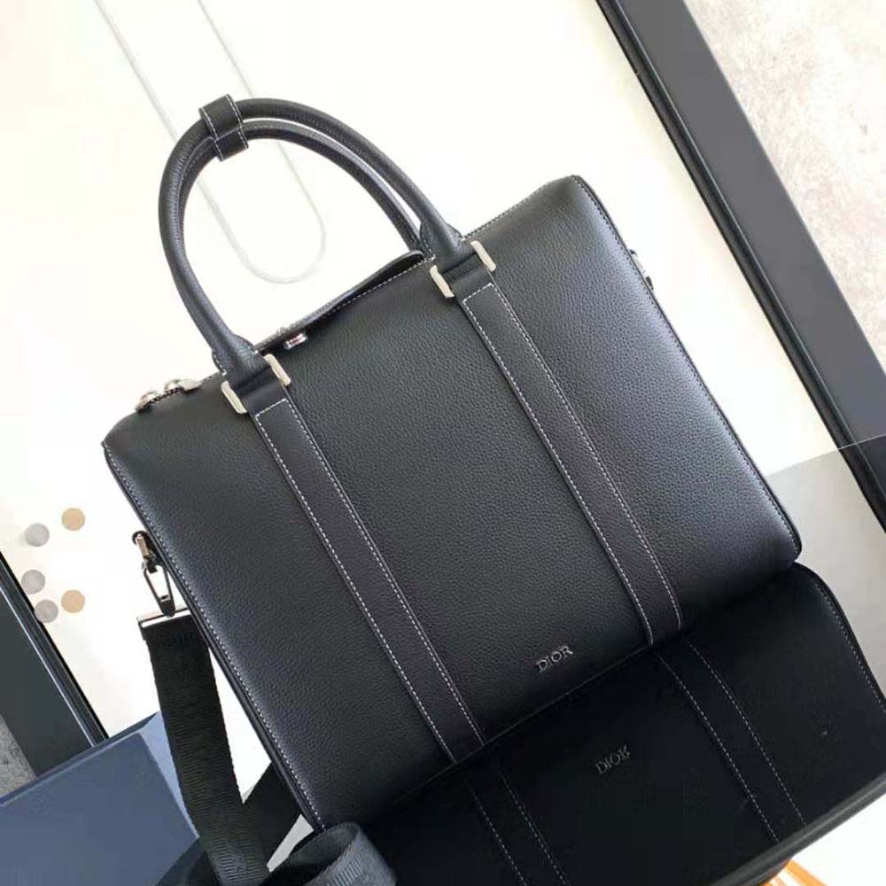 Close-up of grained calfskin texture on Dior Men Lingot Briefcase in black