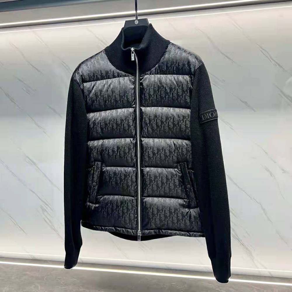 Close-up detail of Dior oblique pattern on black wool knit jacket