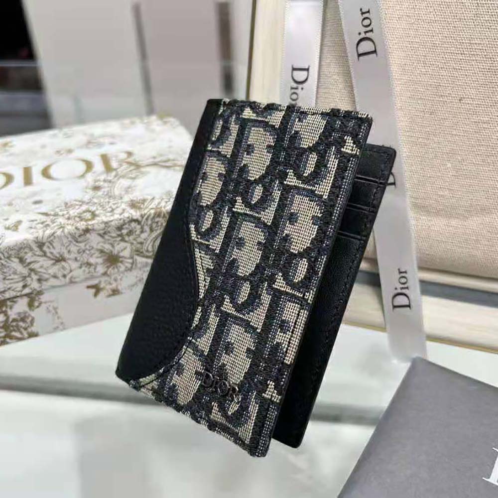 Open view showing card slots inside Dior Men Saddle Bi-fold Card Holder