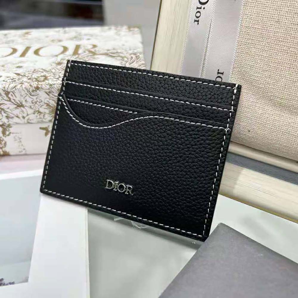 Close-up of silver 'Dior' hardware on card holder leather