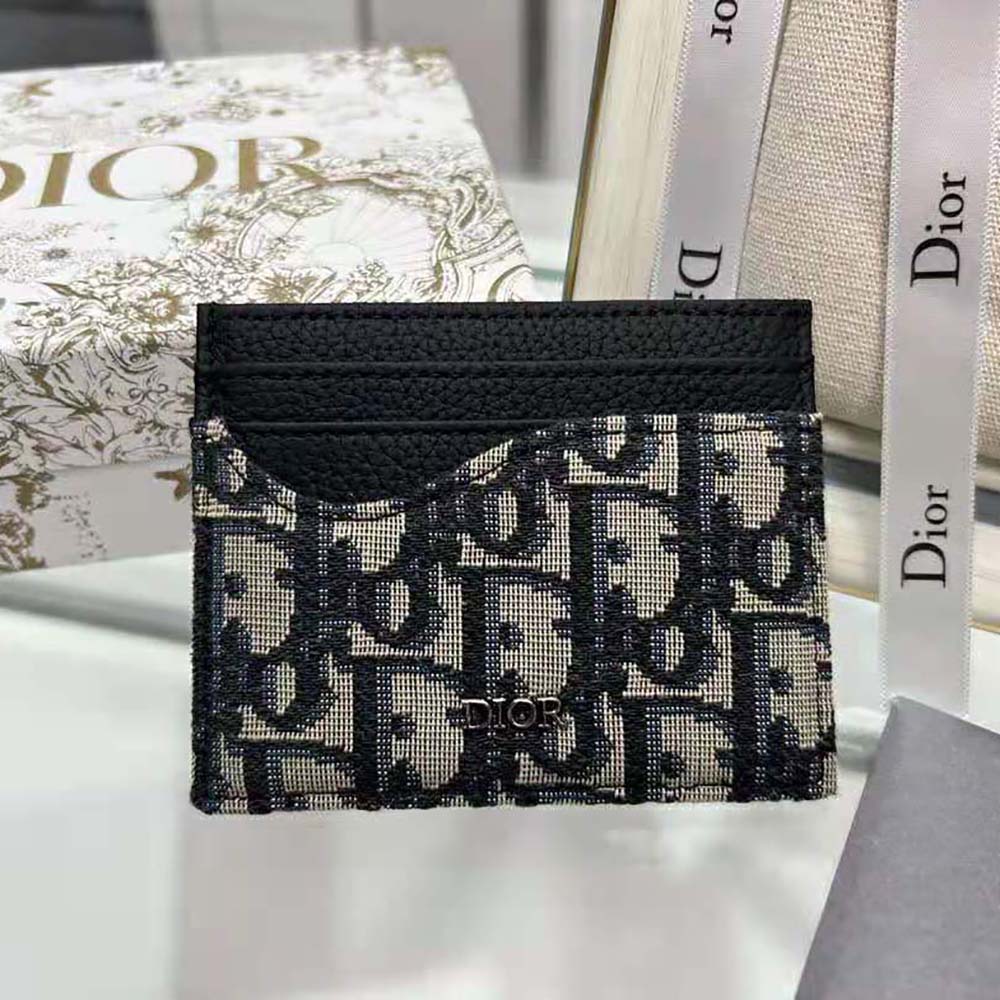 Side angle showing slim silhouette of Dior Men Saddle Card Holder Black